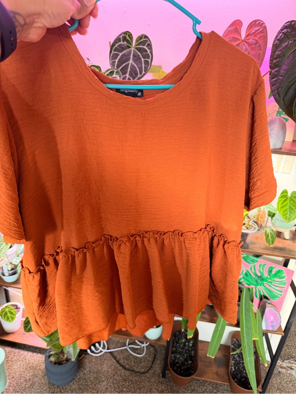 Ruffle-Hem Peplum Top — Rust Orange
